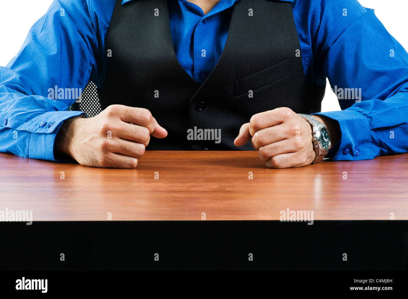 Hombre en camisa azul y chaleco negro sentado fotografías e imágenes de  alta resolución - Alamy