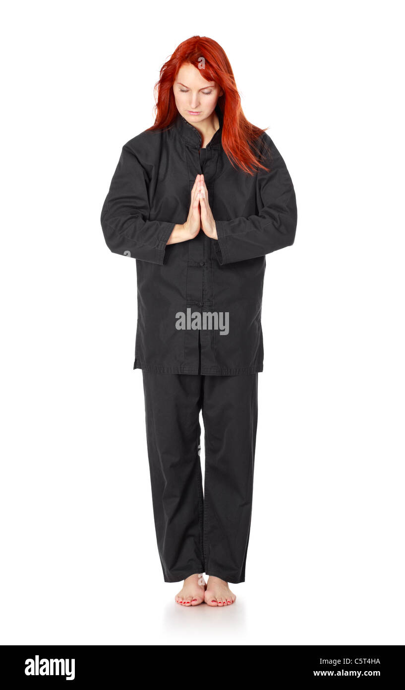Chica en kimono negro saludos, aislado en blanco Foto de stock