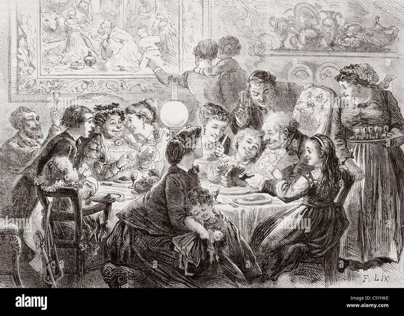Un familiar del siglo XIX juntarse y disfrutar de una fiesta en el día de la Epifanía, el 6 de enero. Foto de stock