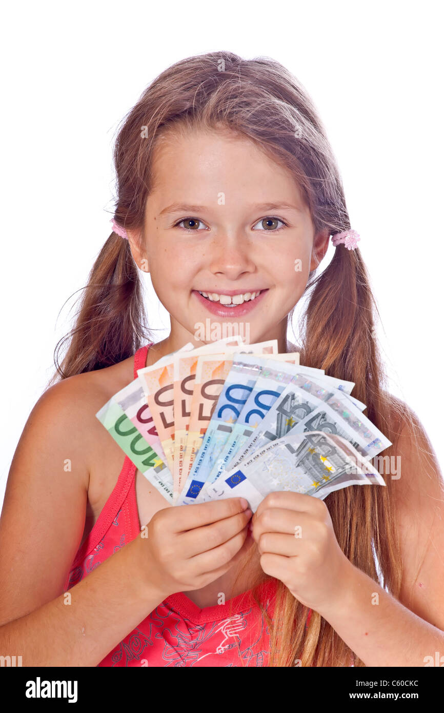 Los ocho años de edad, niña cuenta su dinero Foto de stock