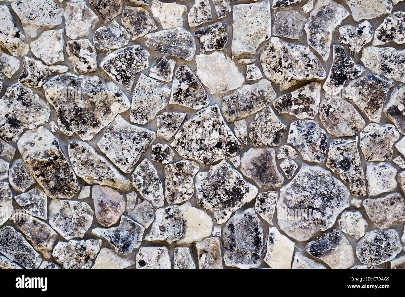 La textura de los antiguos muros de piedra como fondo Foto de stock