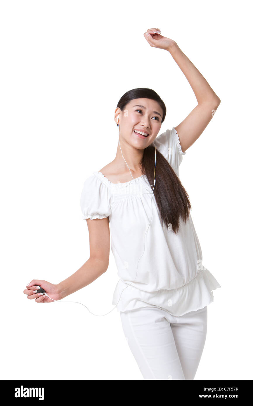 Mujer joven Escuchando música Foto de stock