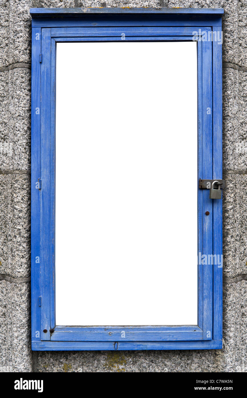 Foto de un tablón de anuncios antiguo de madera con la pintura descarapelada azul sobre una pared de granito, espacio en blanco Foto de stock