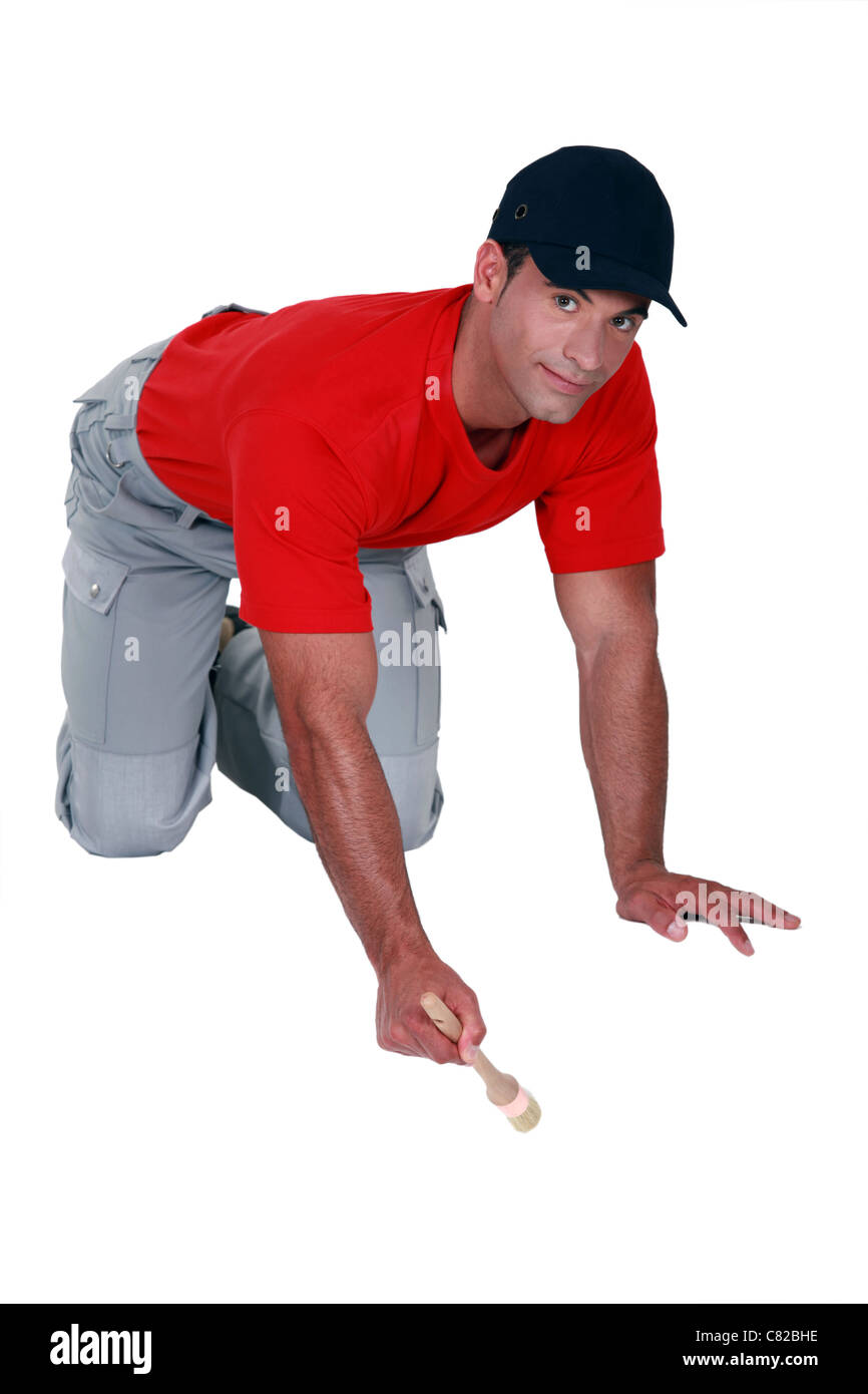 Un pintor trabajando en el piso Fotografía de stock Alamy