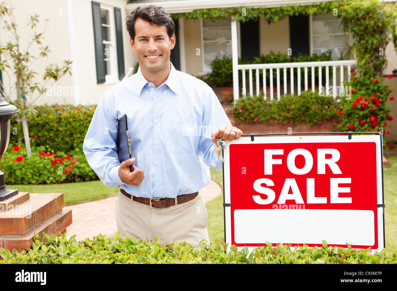 Agente de la propiedad inmobiliaria en el trabajo Foto de stock