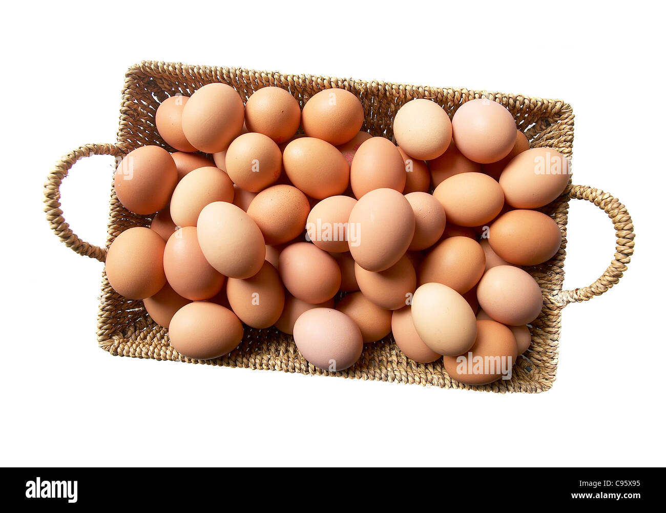 Muchos huevos en una sola canasta Foto de stock