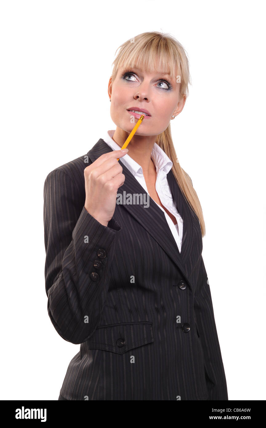 Dama de negocios con lápiz pensando Foto de stock