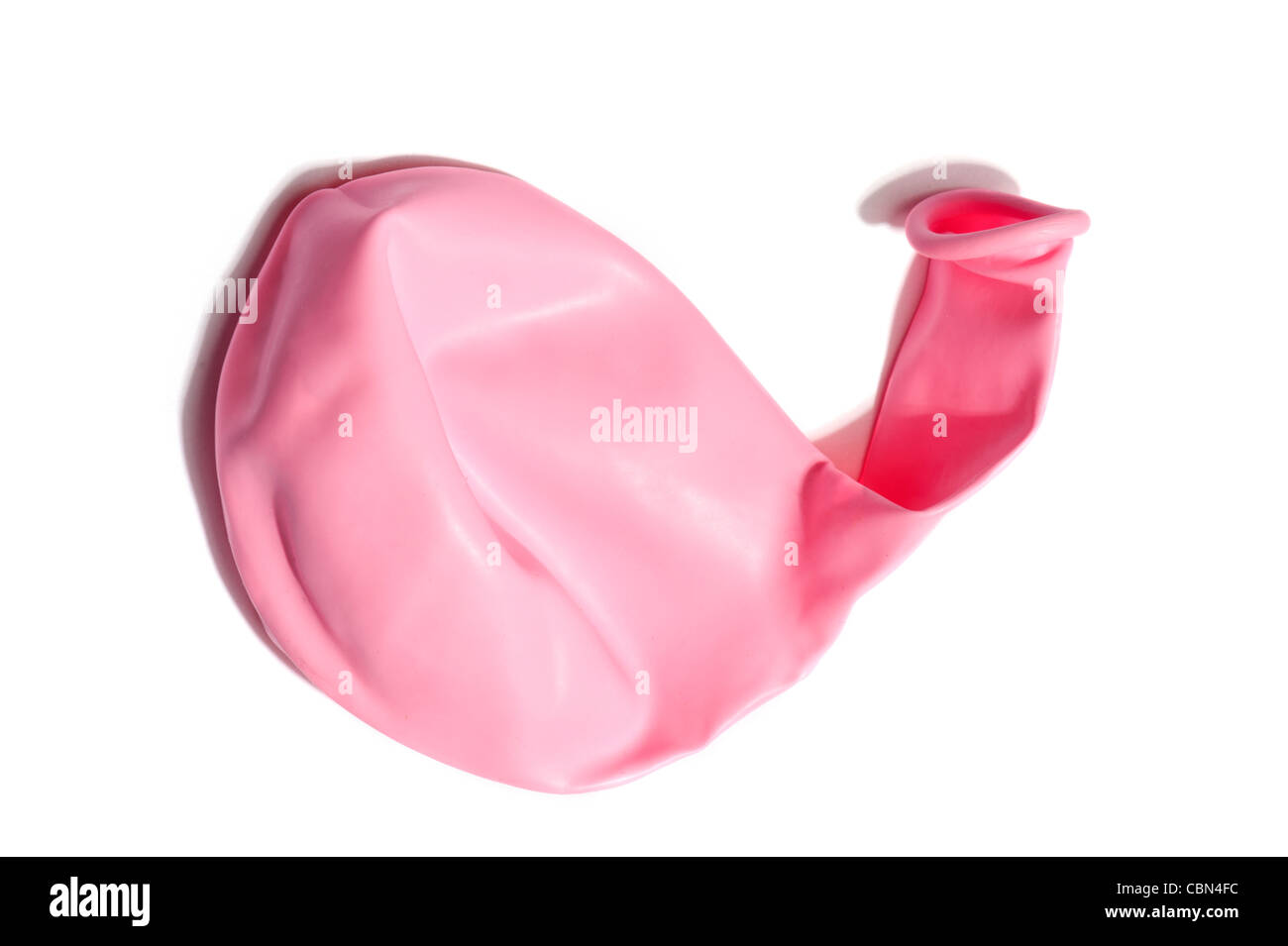 Un globo rosa desinflado Foto de stock