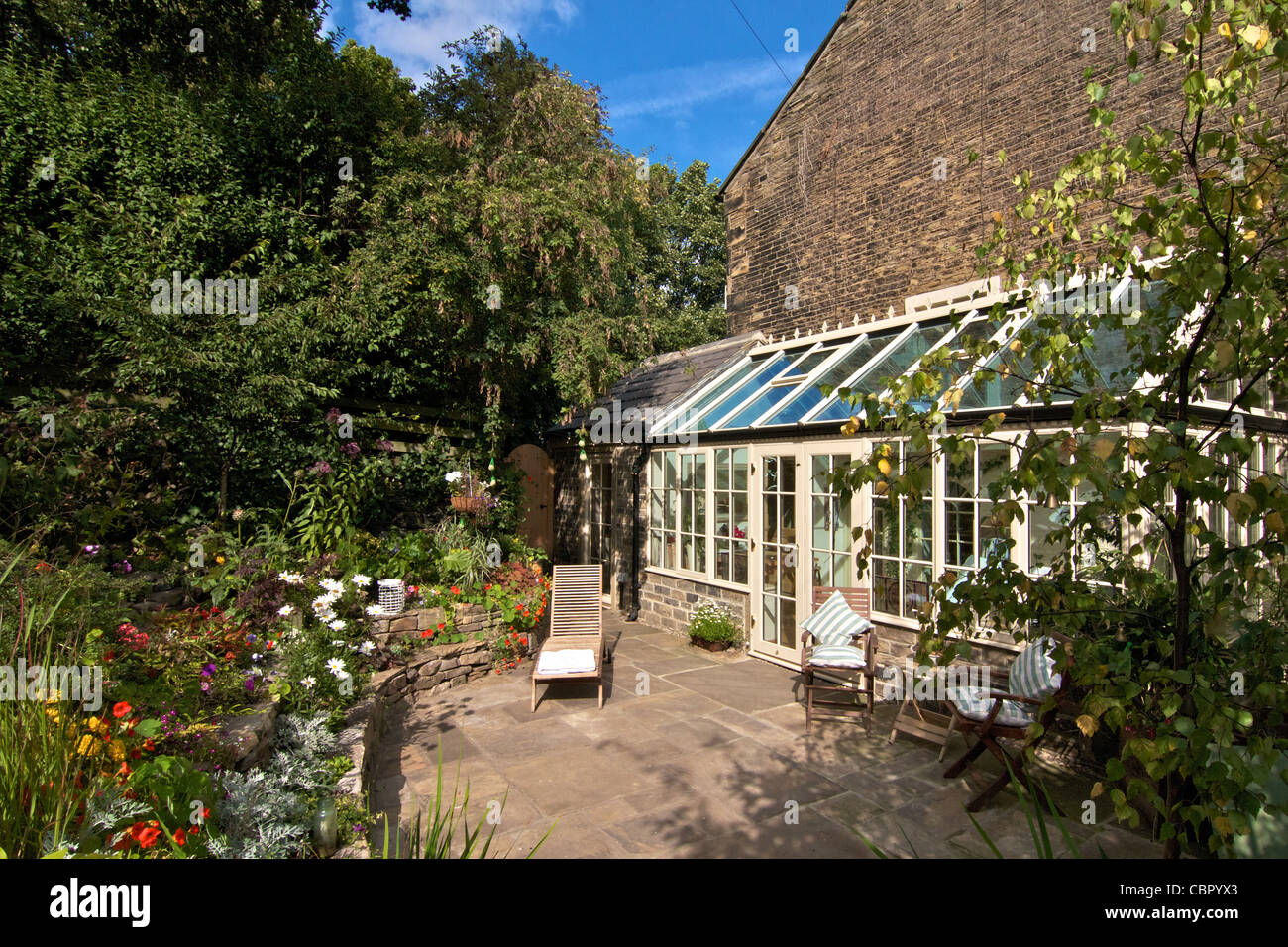 El cottage garden y el conservatorio Foto de stock