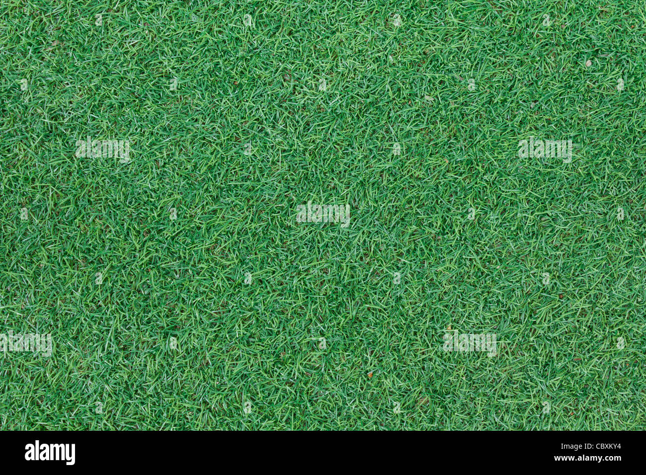 Textura de fondo con falsos hierba en un parque infantil público, vista superior Foto de stock