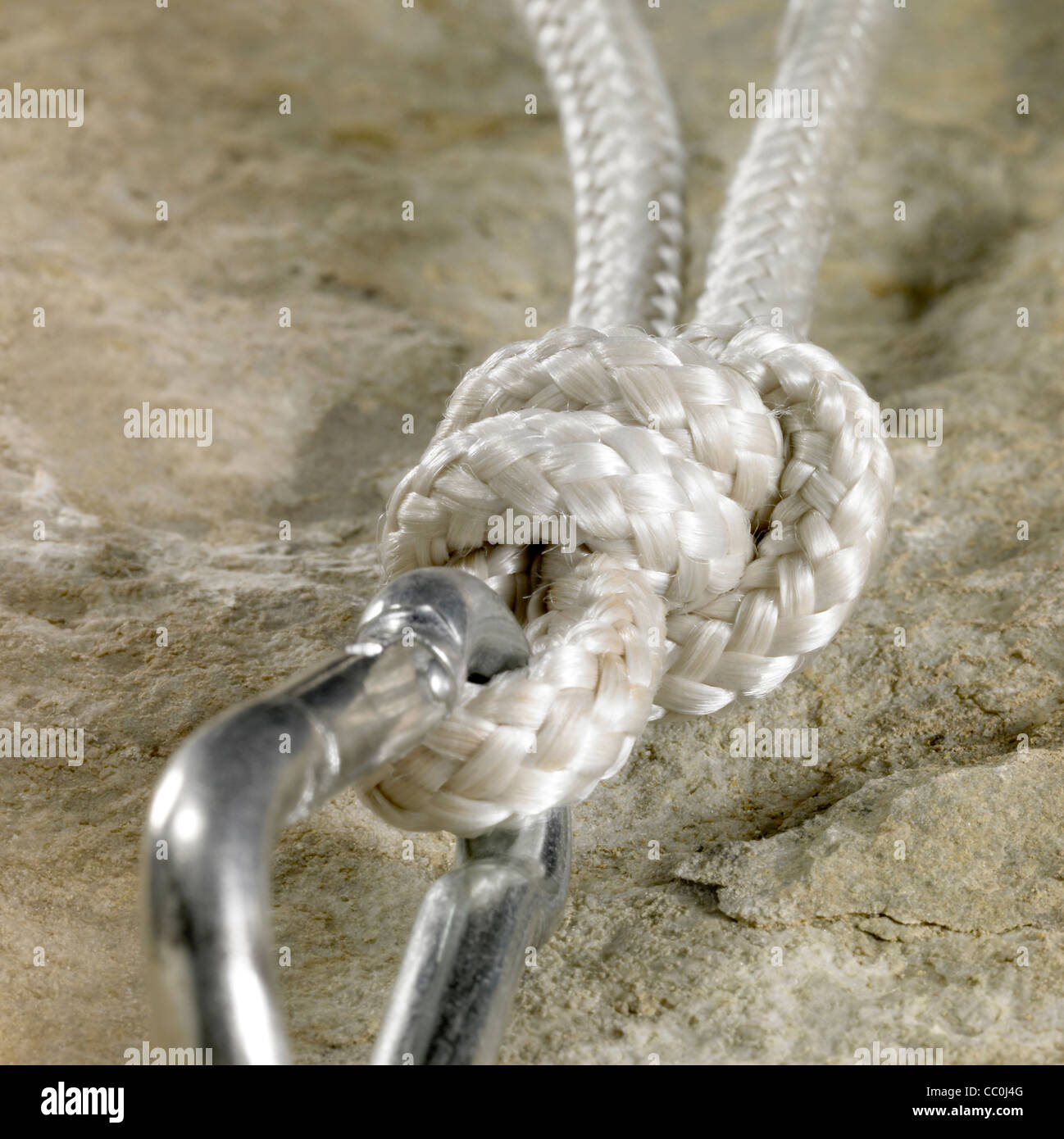 Gancho y la soga en la superficie de la piedra Fotografía de stock - Alamy