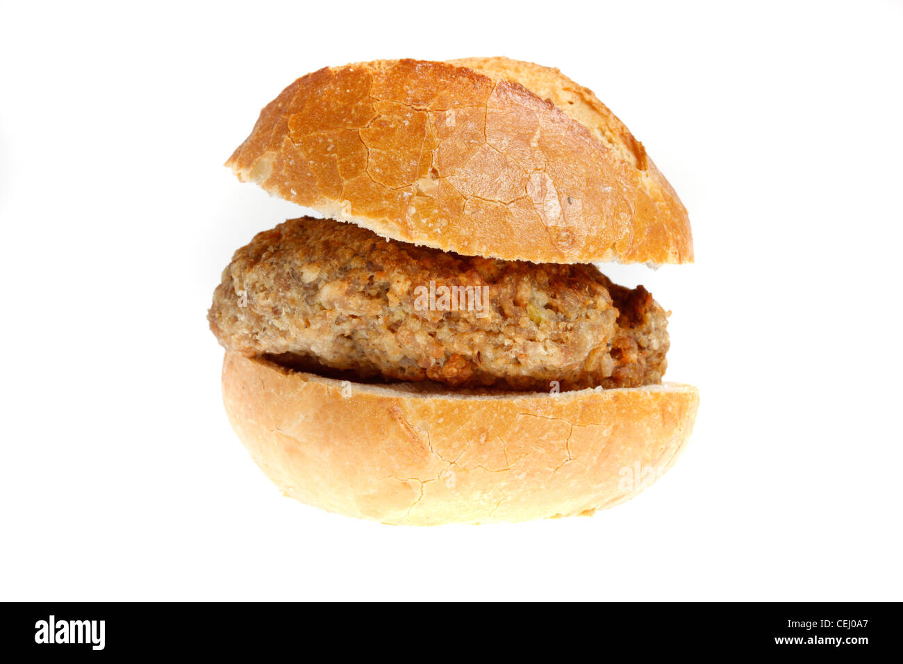 Nutrición, comida rápida. Bollo de pan con una bola de carne de res y la  salsa de tomate ketchup Fotografía de stock - Alamy