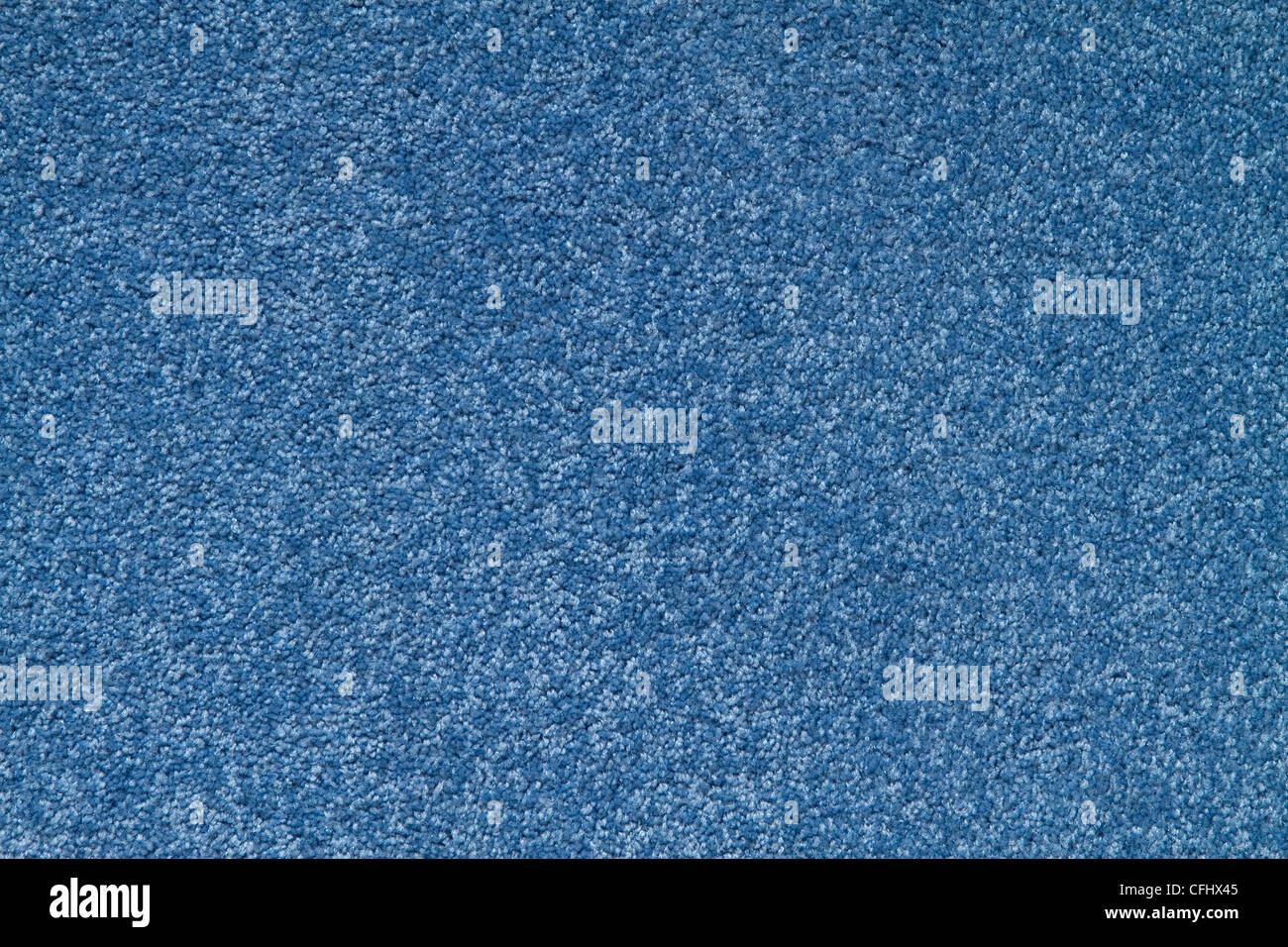 La textura de una alfombra de color azul con poca pila. Foto de stock