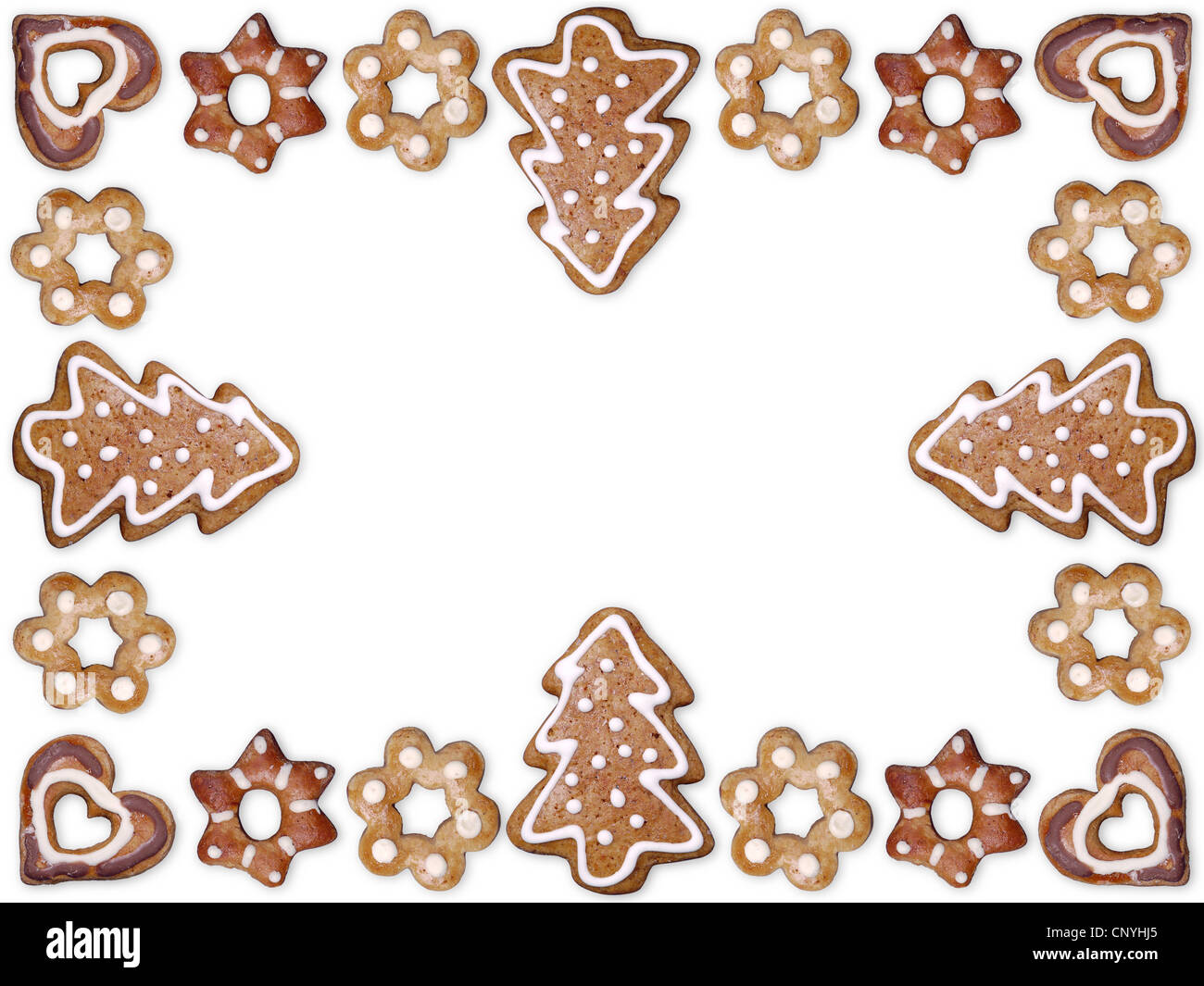 Decorativa forma estacional gingerbread cookies organizados en bastidor con fondo blanco. Foto de stock