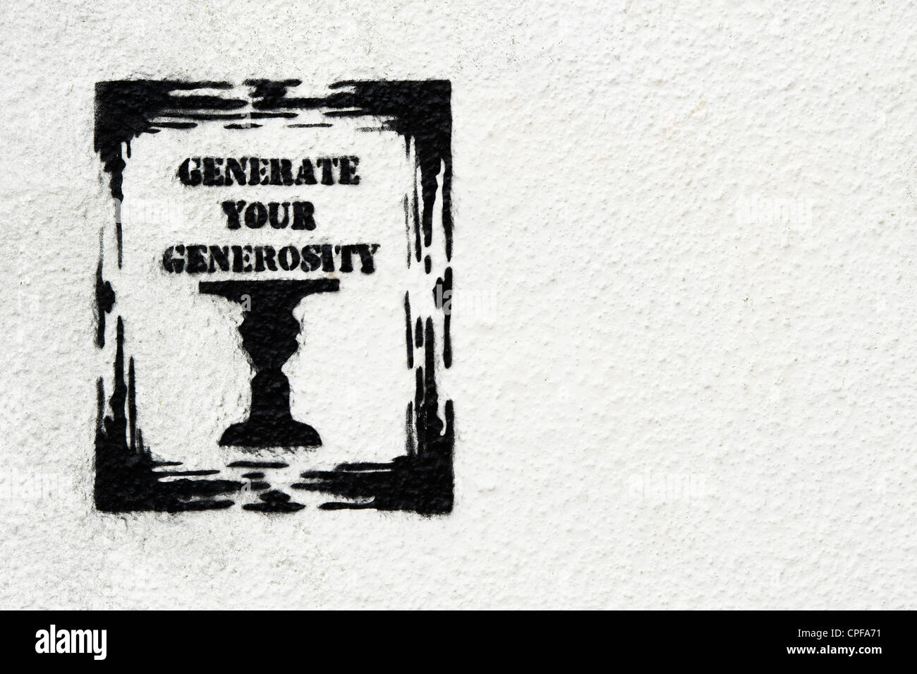 Generar su generosidad graffiti en una pared. Foto de stock