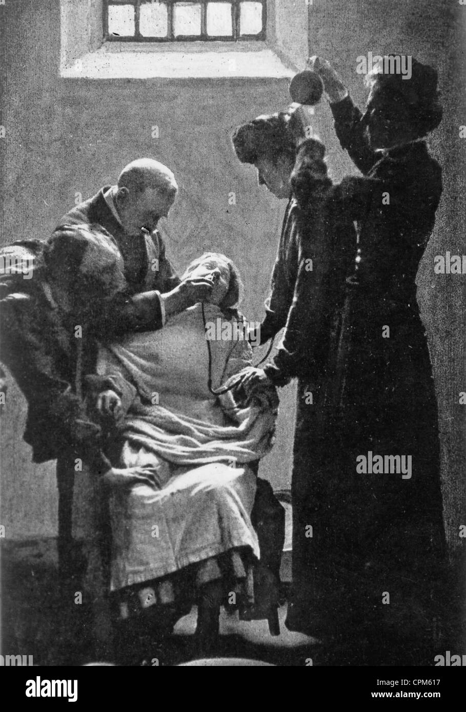 Alimentación forzada un suffragette en huelga de hambre, 1909 Foto de stock