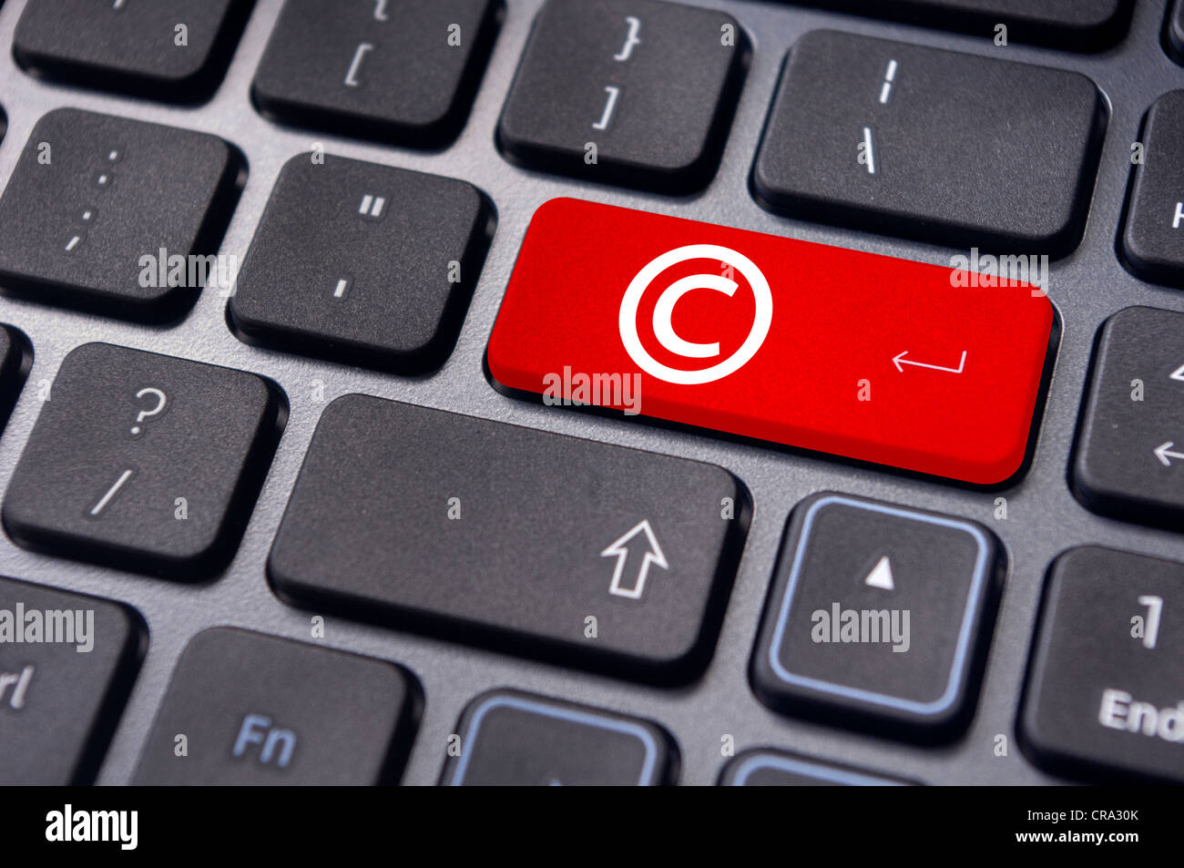 Un símbolo de copyright en el teclado para ilustrar los conceptos  Fotografía de stock - Alamy
