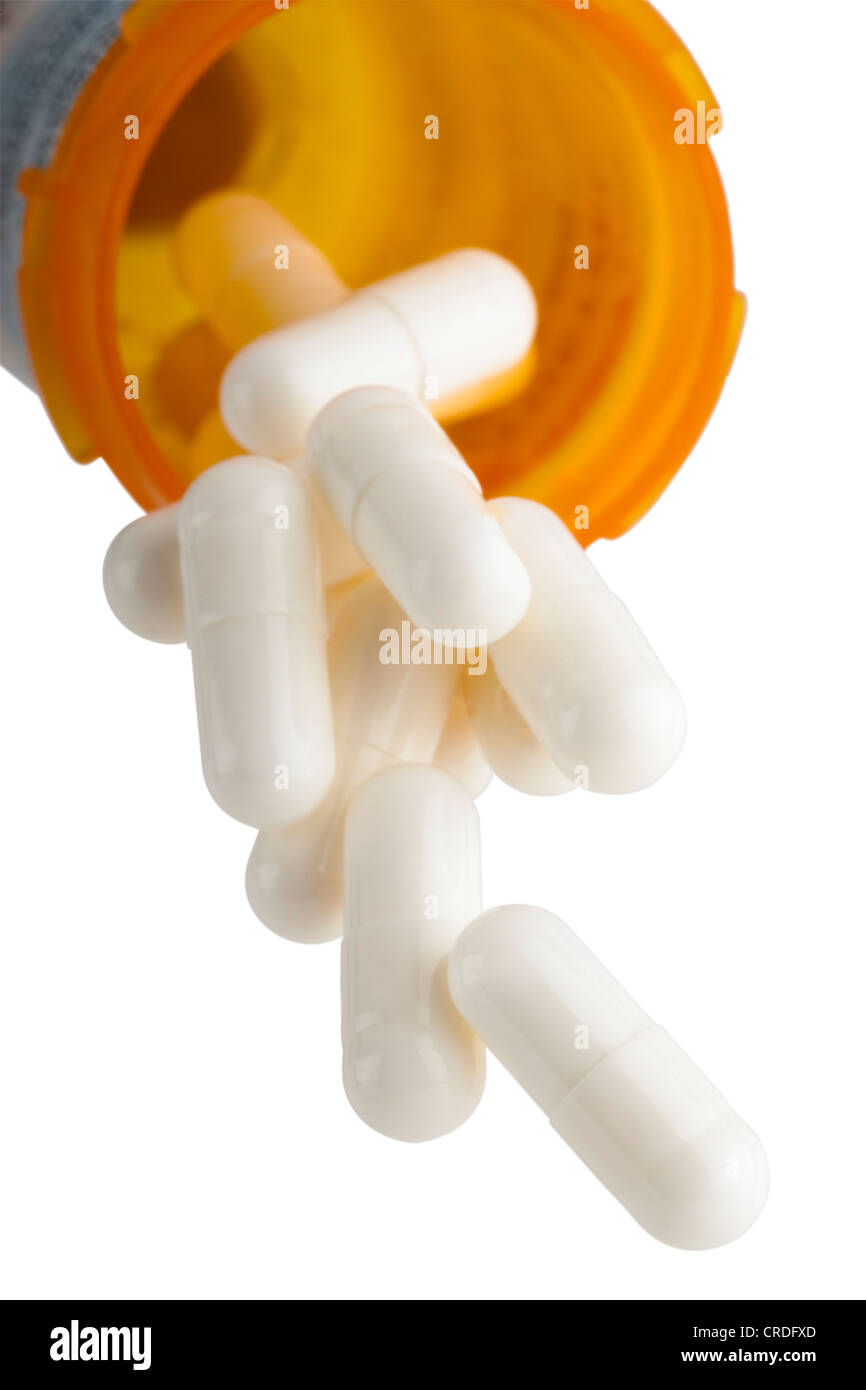 Las píldoras se caigan de botella de prescripción Foto de stock