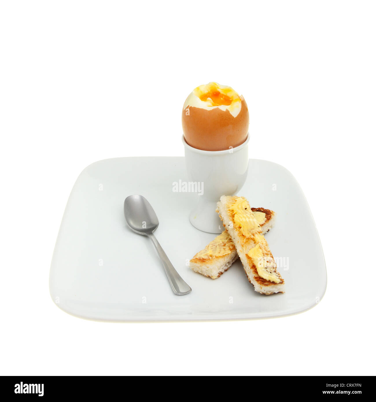 Huevo cocido y huevera con cuchara Fotografía de stock - Alamy