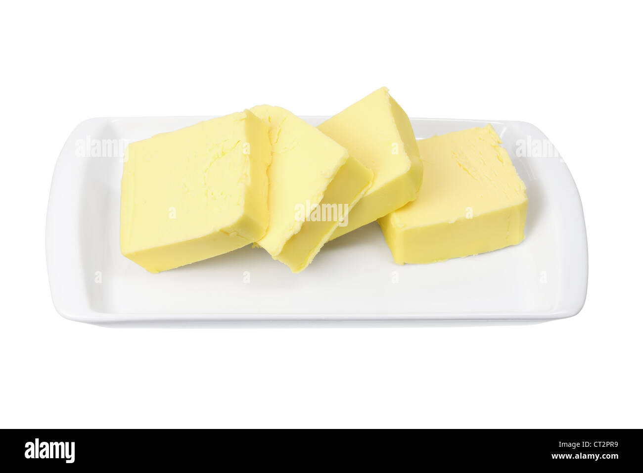 Rebanadas de mantequilla en la placa Foto de stock