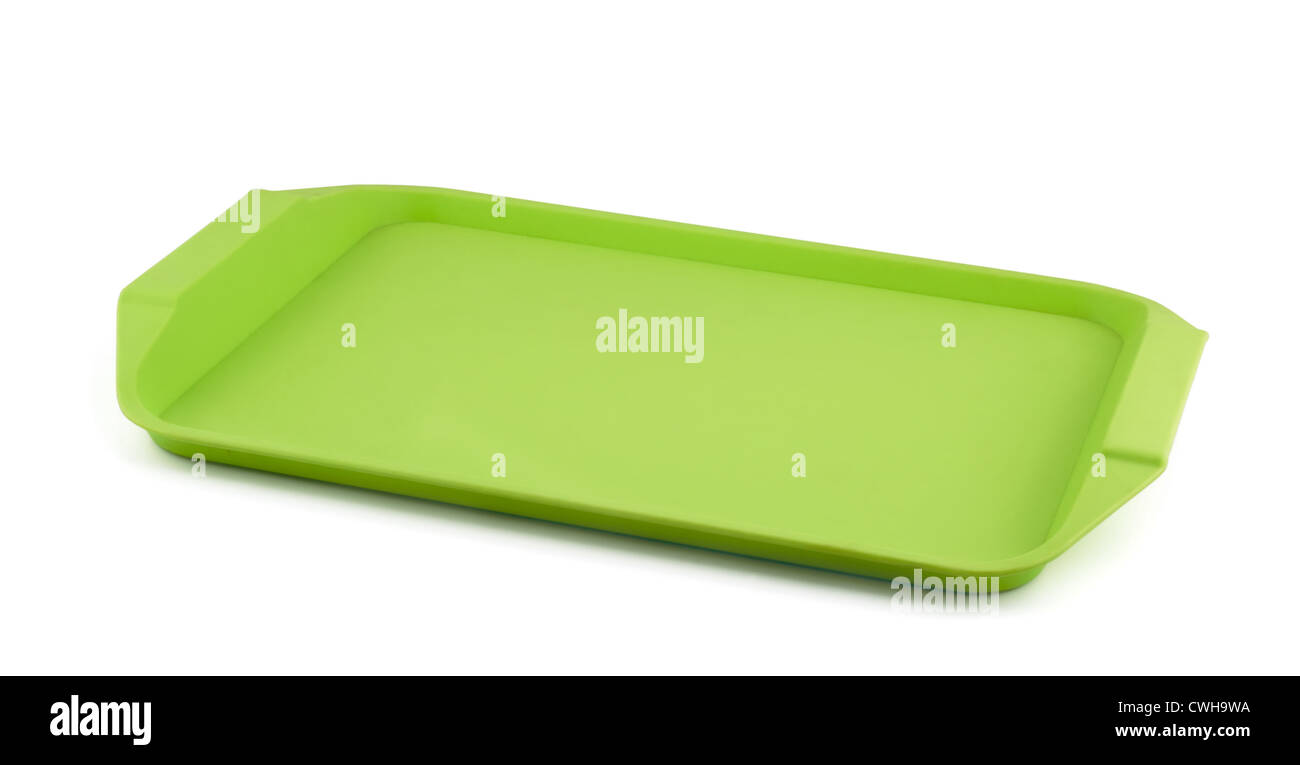 Vacíe la bandeja de plástico verde aislado en blanco Foto de stock