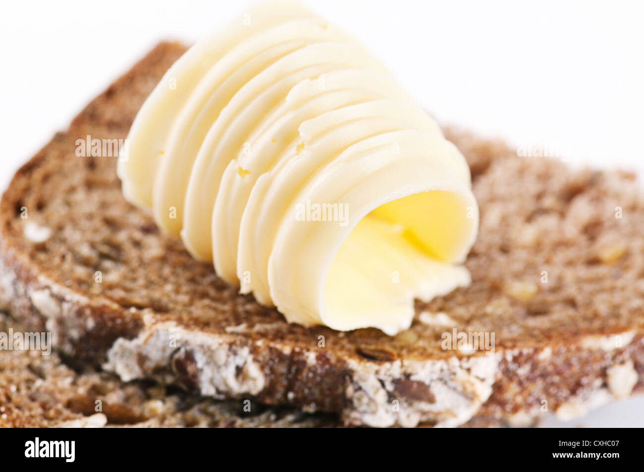 Trozo de pan con mantequilla Foto de stock