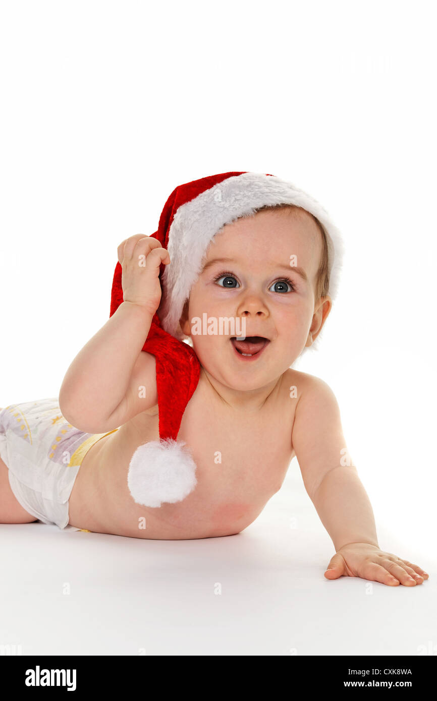 Bebé niño con Santa Claus hat Foto de stock