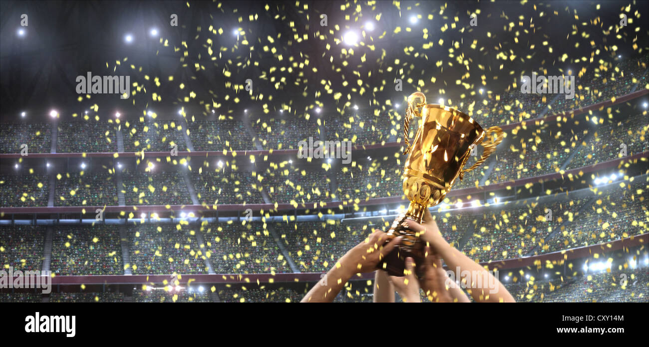 Trofeo, estadio de fútbol, vítores, brazos, confeti, stands Foto de stock