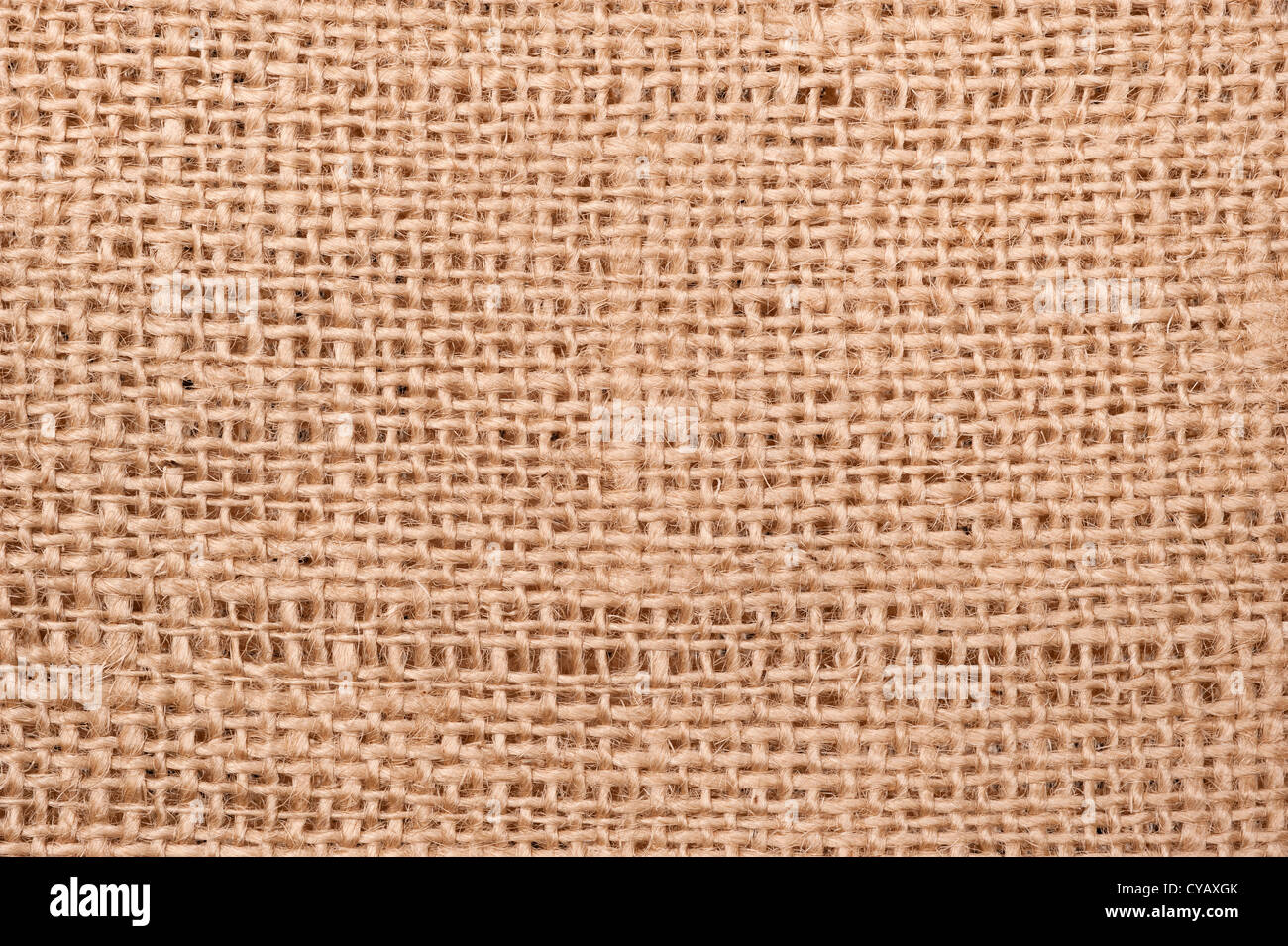 Cierre de un beige saco de arpillera que muestra los detalles de la fibra y patrón woven. Foto de stock