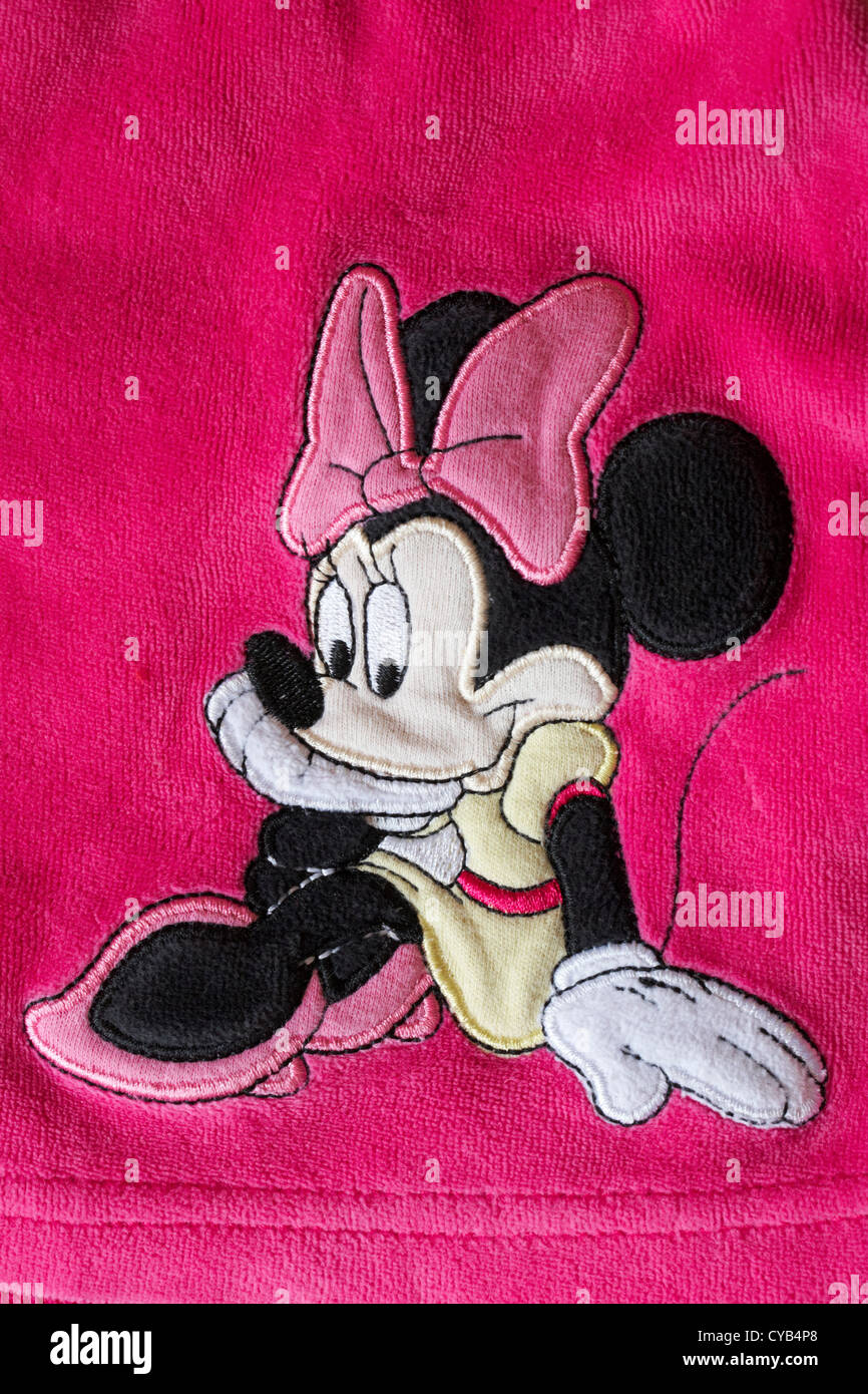 dentro biblioteca orientación Detalle de sentarse Minnie Mouse en Little Girl's vestido rosado Fotografía  de stock - Alamy