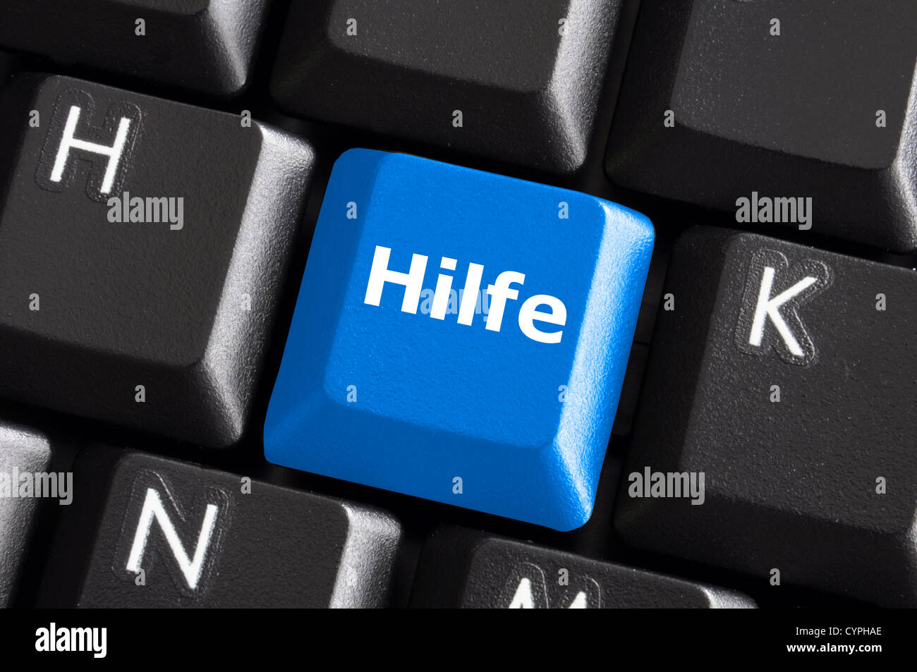 Palabra alemana Hilfe mostrando ayuda o asistencia en concepto con teclado Foto de stock