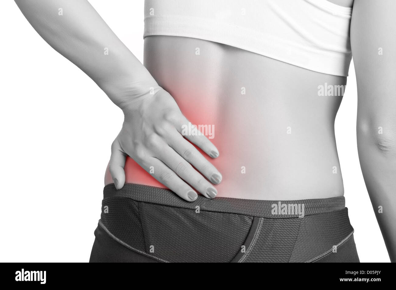 Mujer joven con dolor en su espalda baja Fotografía de stock - Alamy