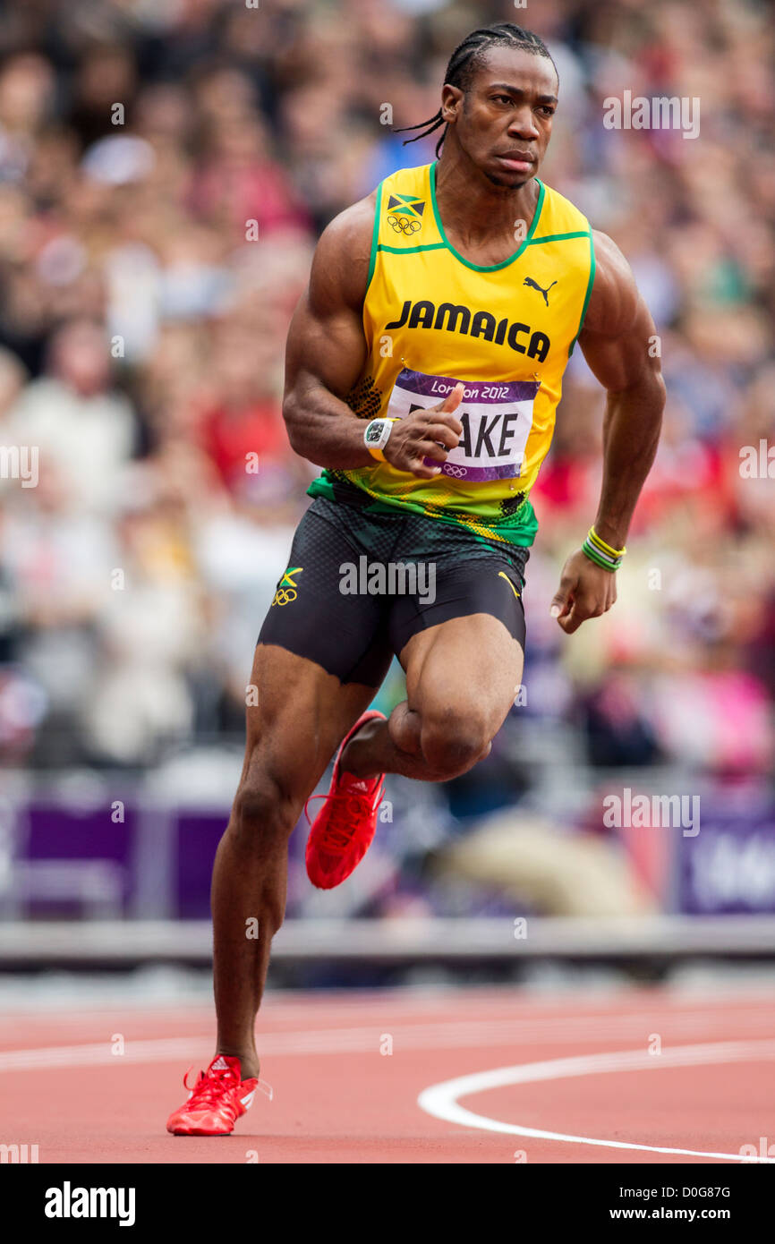 Yohan Blake (JAM) compitiendo en los hombres de la 1ª ronda de 100m en el verano de los Juegos Olímpicos de Londres 2012 Foto de stock