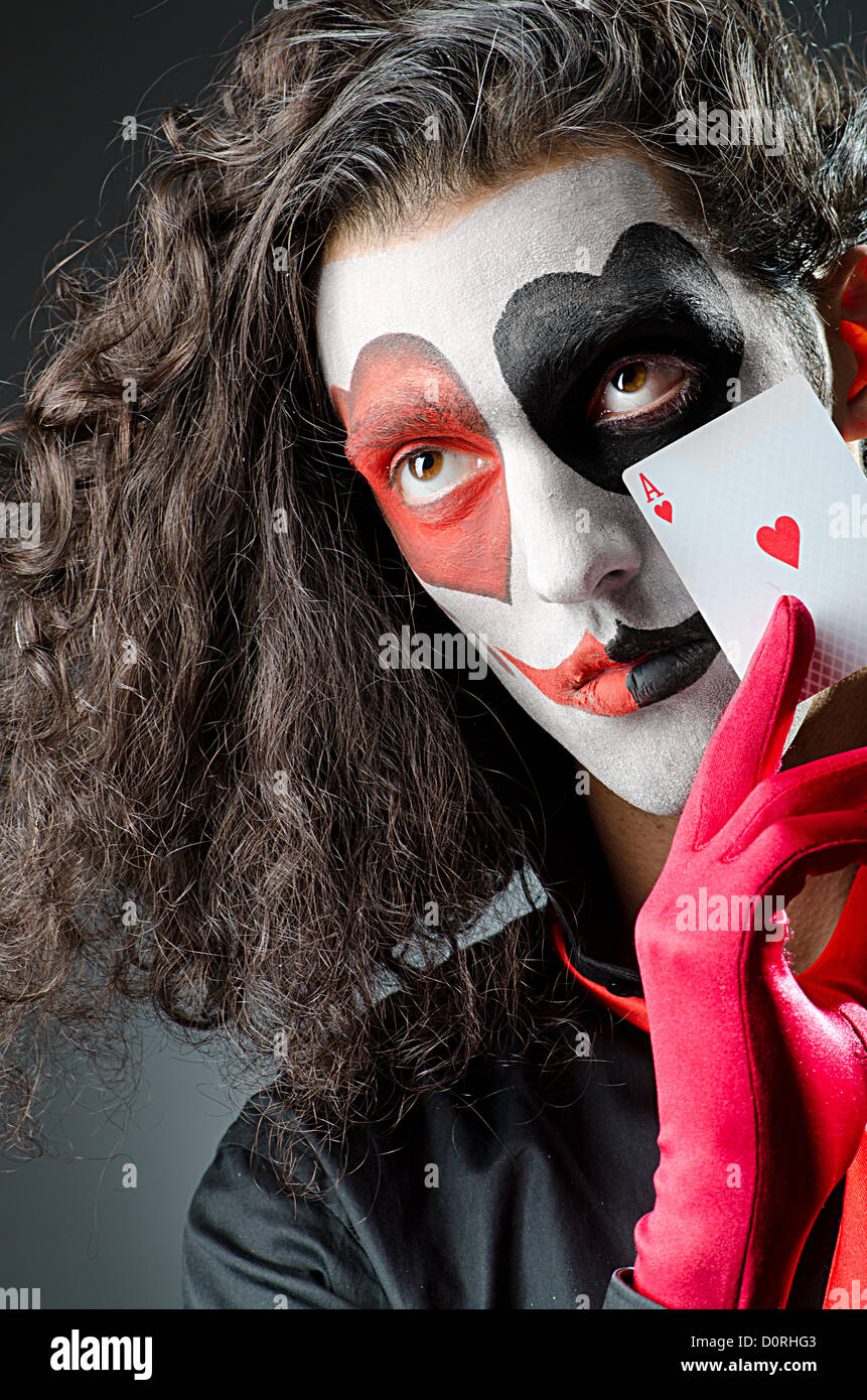 Joker con máscara facial en studio Foto de stock