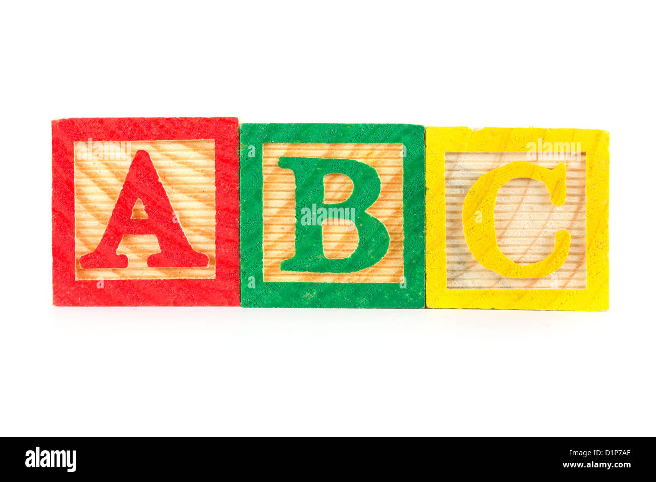 ABC de madera bloques de aprendizaje en una fila en blanco Foto de stock