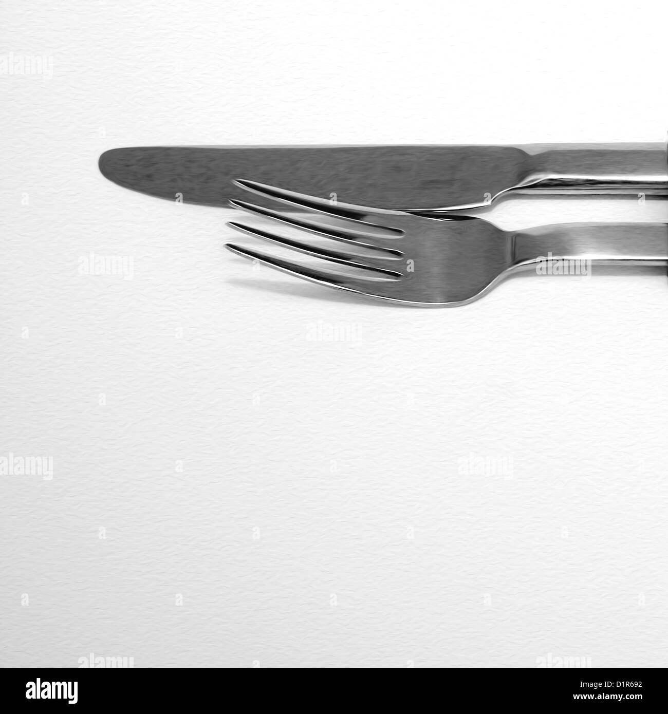 Parte superior de un tenedor y un cuchillo sobre blanco Foto de stock