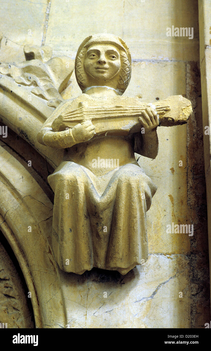 Beverley Minster, músico hembra tallados en piedra medieval, la guitarra, la música, los músicos musicales, Yorkshire, Inglaterra Foto de stock