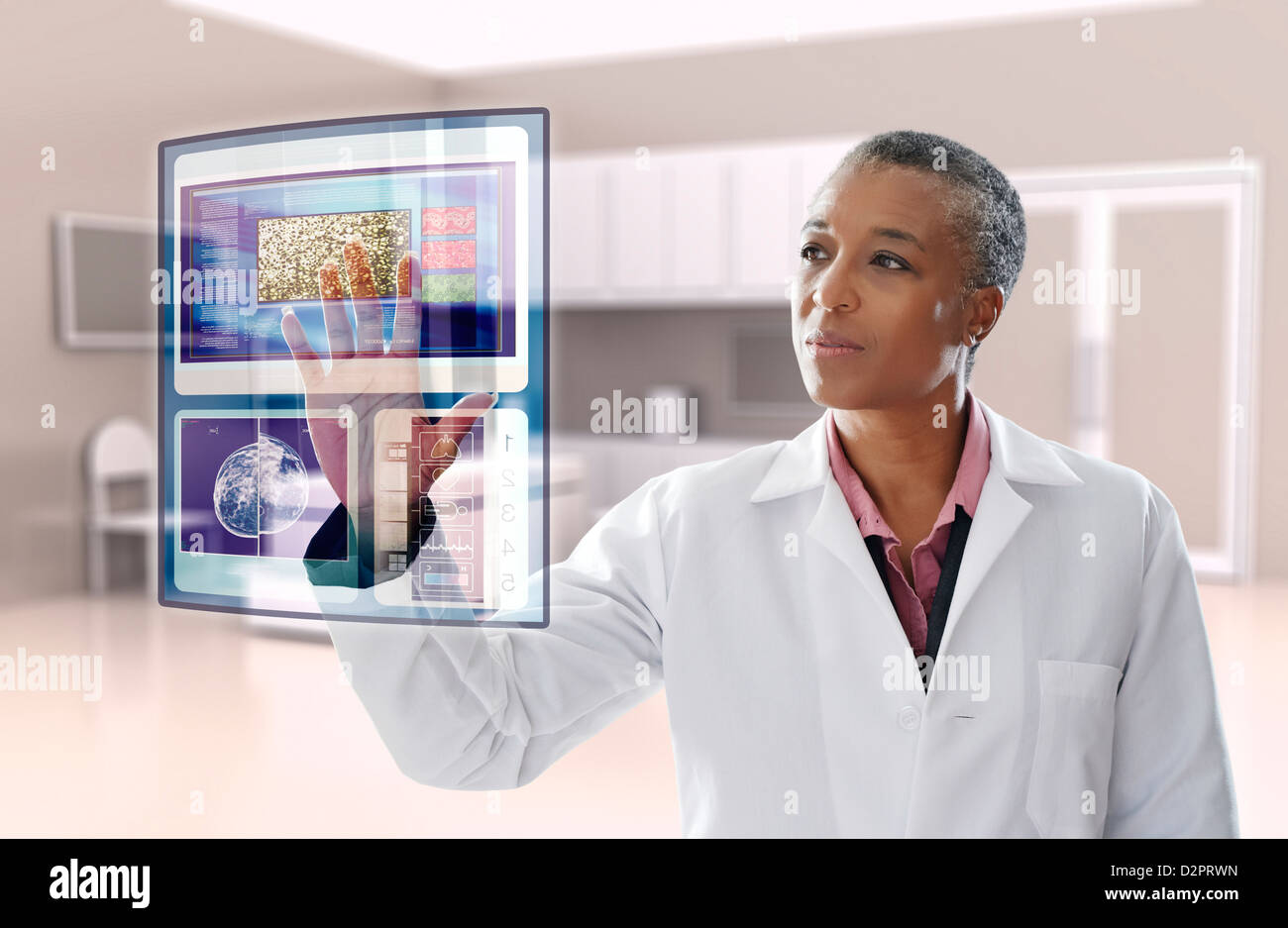 Doctor negro mediante pantalla digital en consultorio médico Foto de stock