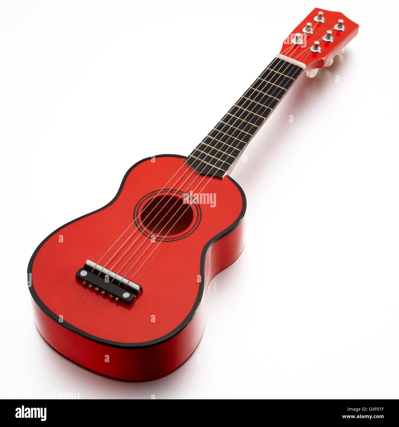 Juguete de madera roja 6 cuerdas de la guitarra Foto de stock