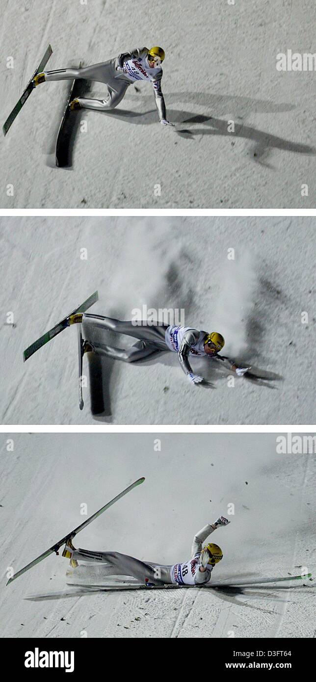 (Dpa) - Puente de esquí finlandés Janne Ahonen falls y repta por la ladera, seguida por una nube de hielo y nieve tras su salto en el Campeonato Mundial de Esquí Nórdico en saltos de esquí en Predazzo, Italia, 22 de febrero de 2003. Foto de stock