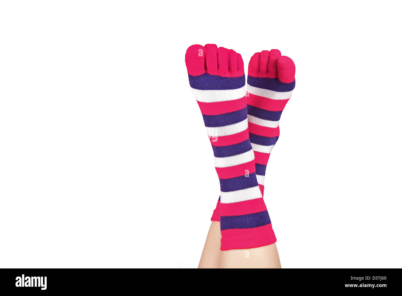 Señoras pies en calcetines separados, aislado en blanco Fotografía de stock - Alamy