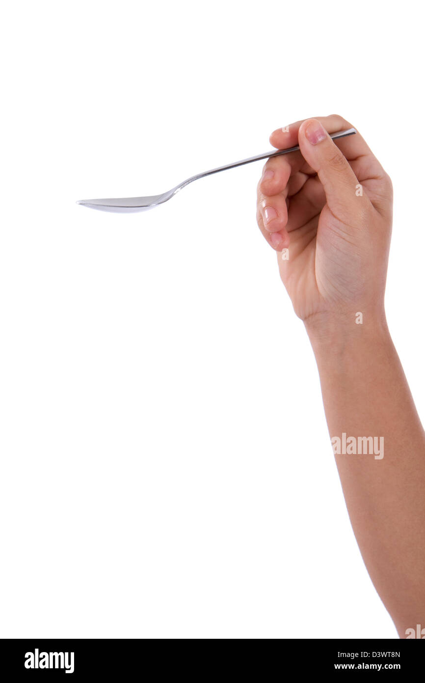 Con el antebrazo, mostrando mano sostiene una cuchara vacía sobre fondo blanco. Foto de stock