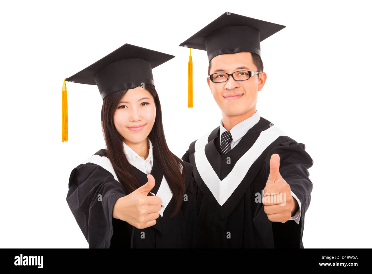 Feliz pareja estudiantes graduados con pulgares arriba aislado en blanco  Fotografía de stock - Alamy