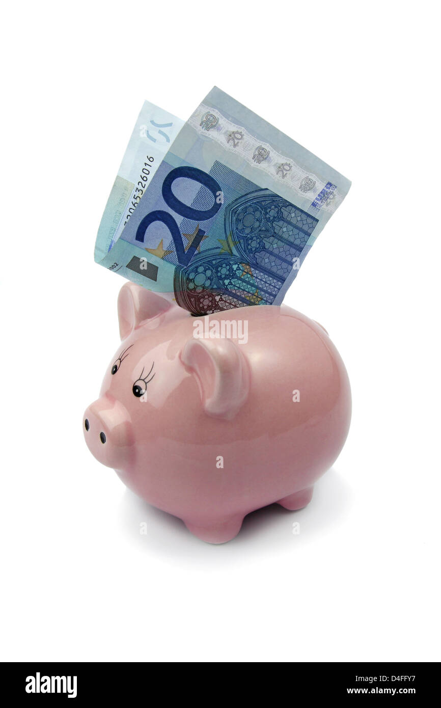 Banco de cerdo con veinte euros aislado sobre fondo blanco. Foto de stock