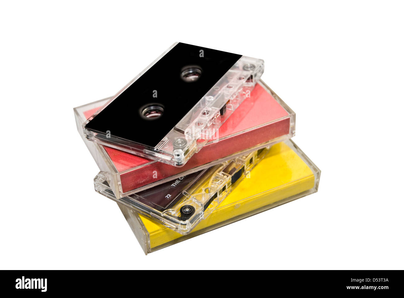 Una pila de viejas cintas de cassette con y sin cajas de plástico. Foto de stock