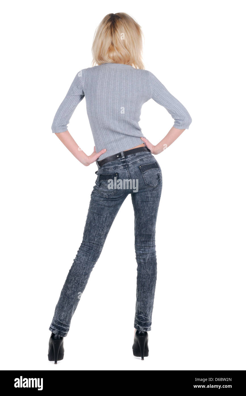 Moda tall señorita. Chica guapa en suéter gris y jeans. Vista posterior.  Aislado sobre fondo blanco. Vista trasera de la gente Fotografía de stock -  Alamy