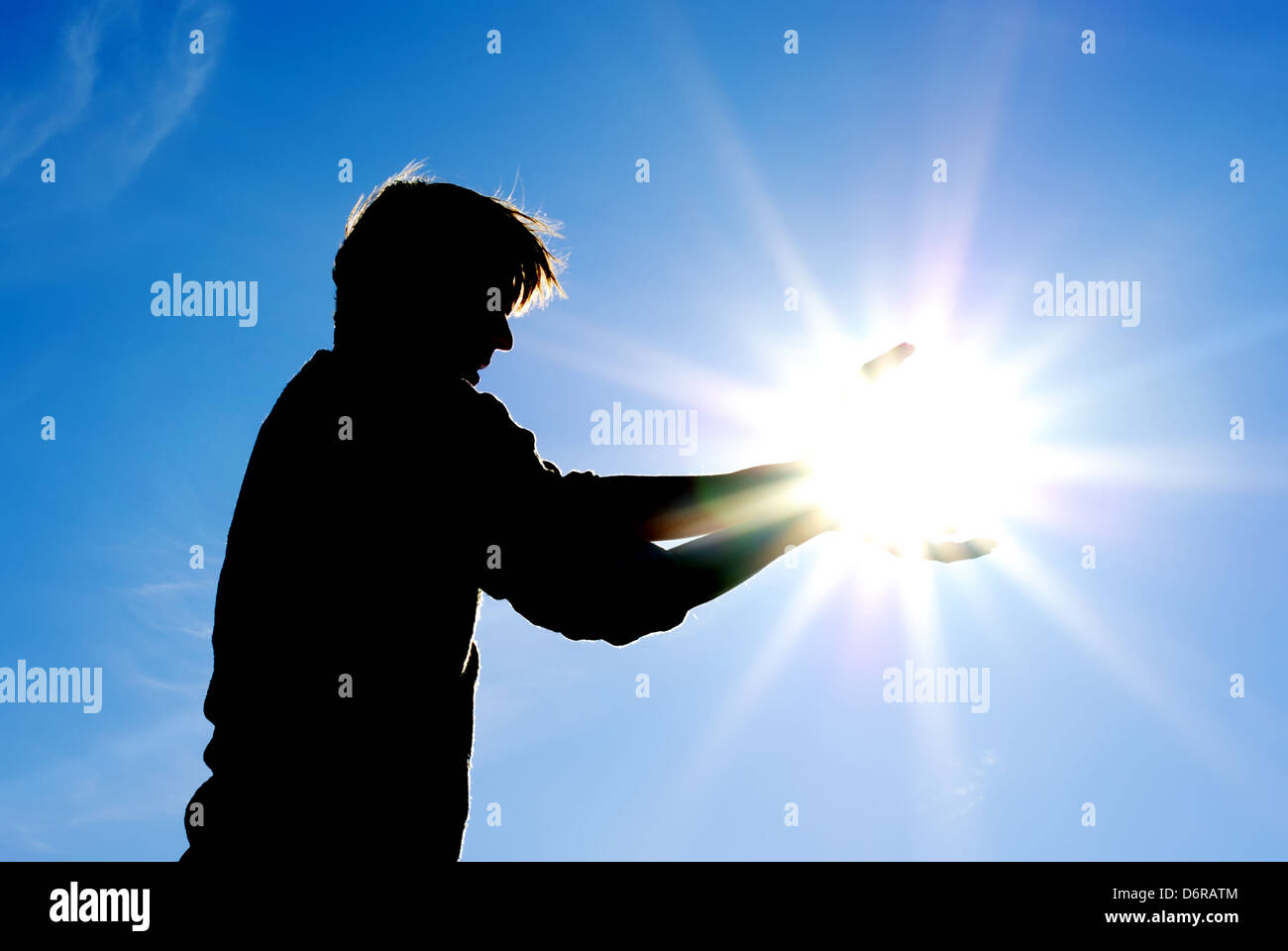 El hombre controlar el sol. Diseño Conceptual. Foto de stock