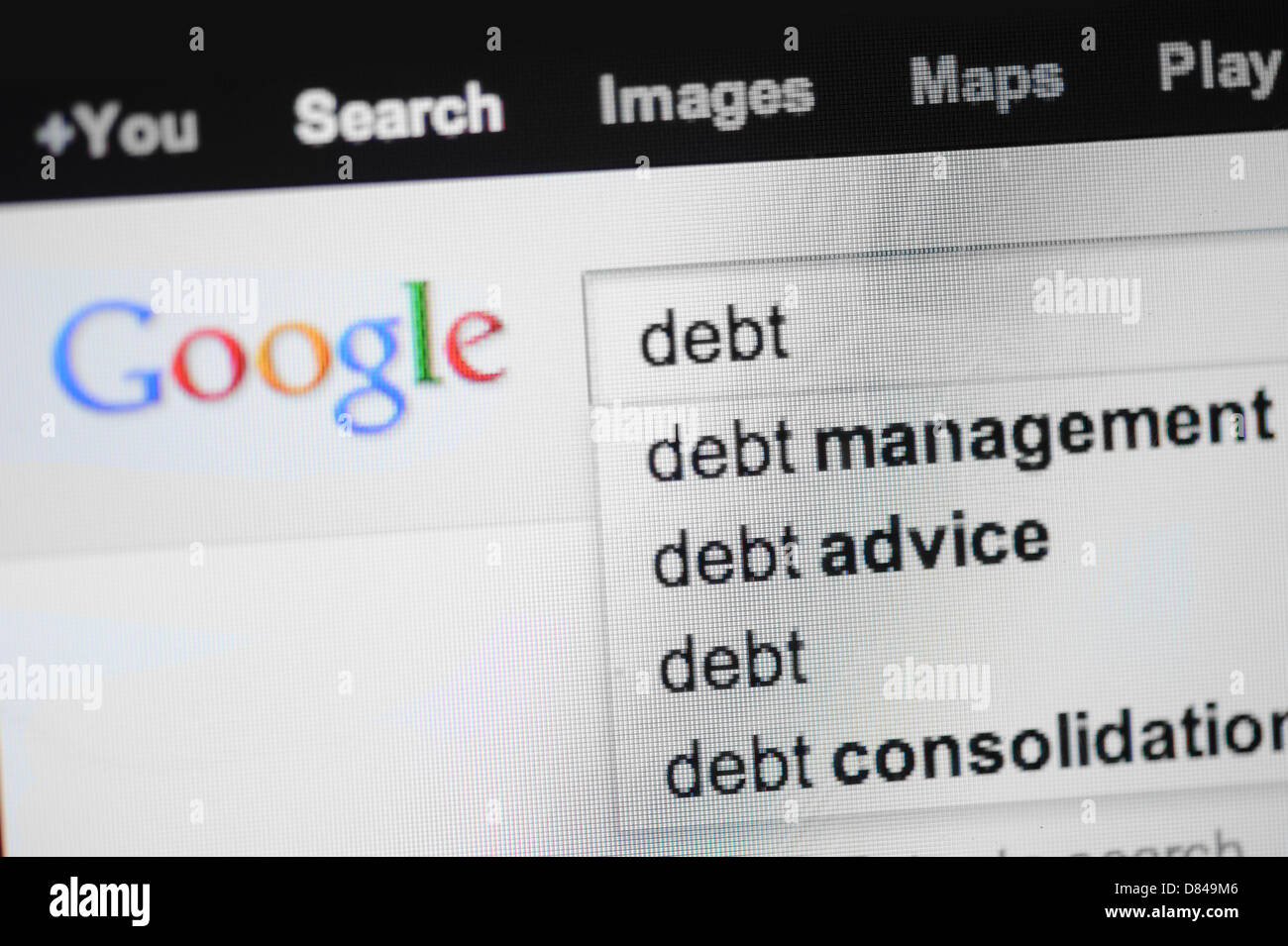 Búsqueda en Google de la deuda. Foto de stock
