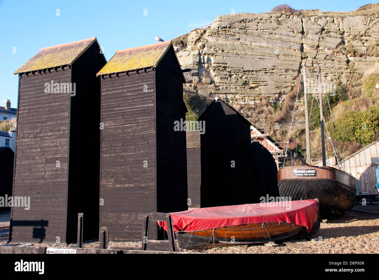 Red de pesca históricas cabañas en Hastings, East Sussex, Inglaterra, Reino Unido. Foto de stock