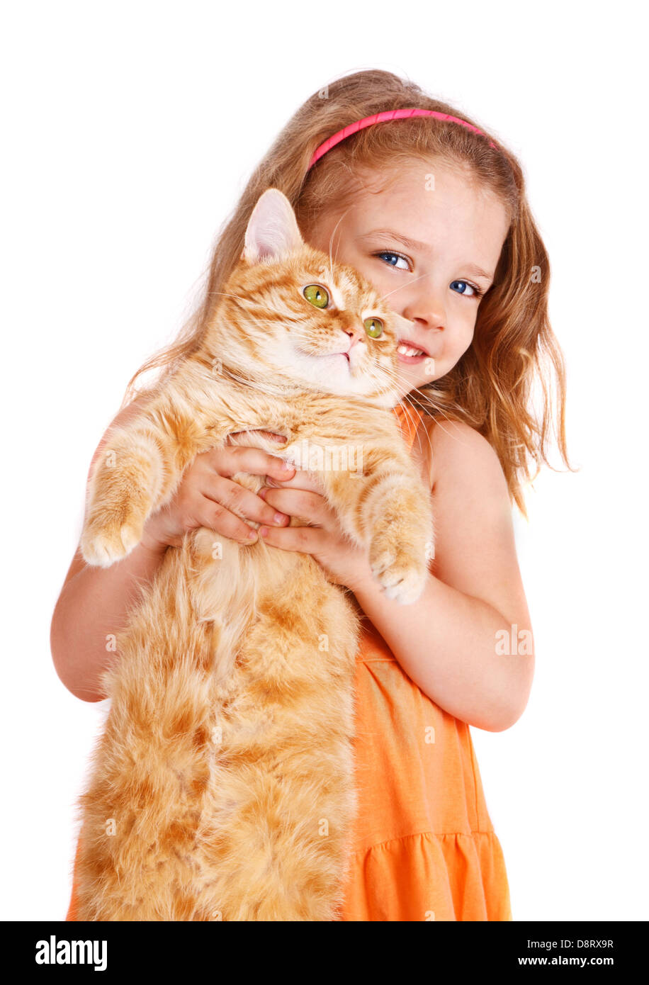 Niña con un gran gato rojo Foto de stock